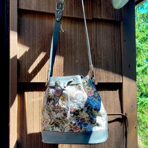 Vintage tapestry with leather trim draw strings purse, one of kind, gently love.